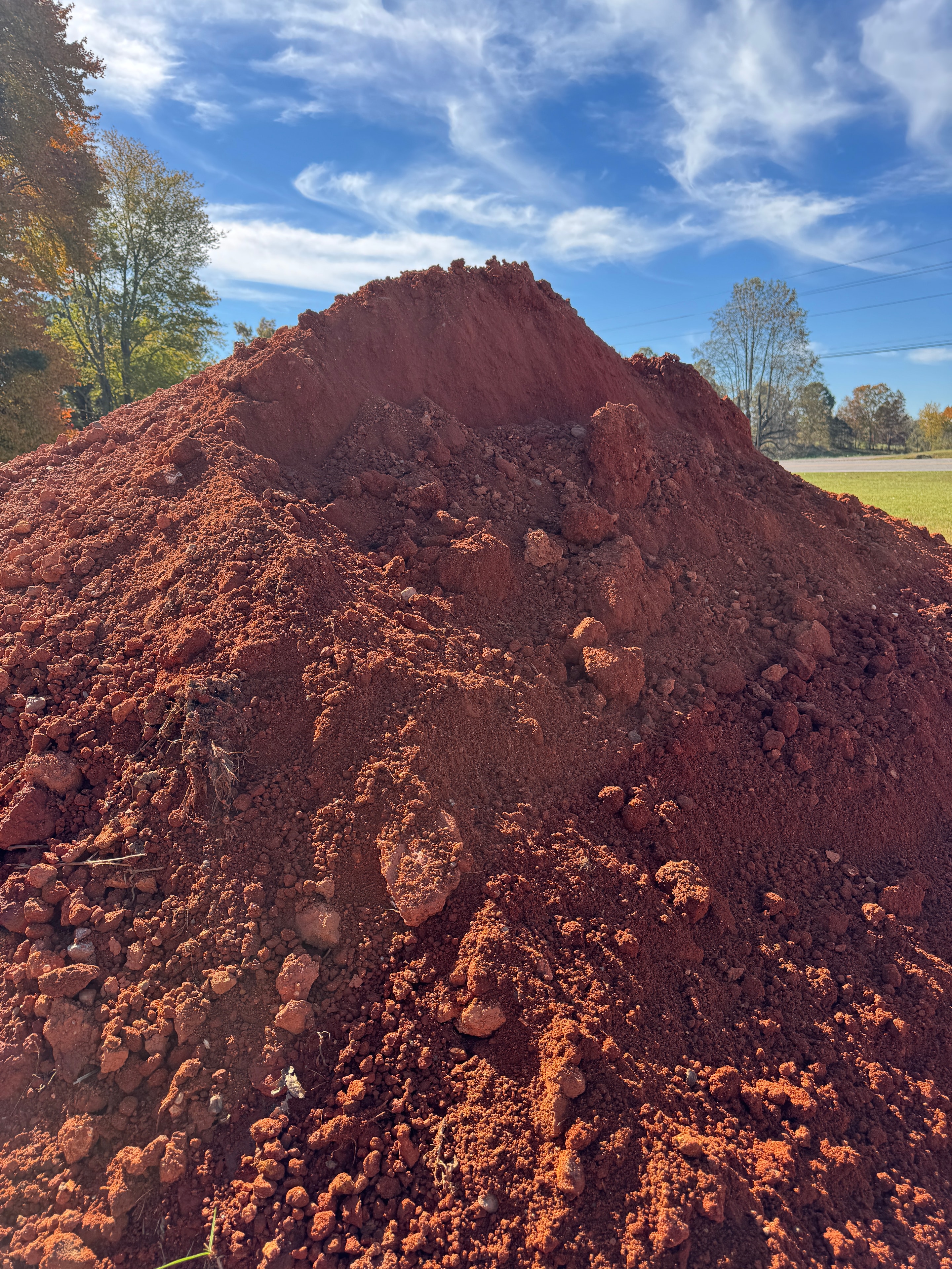 Large pile of red fill dirt at the garden center