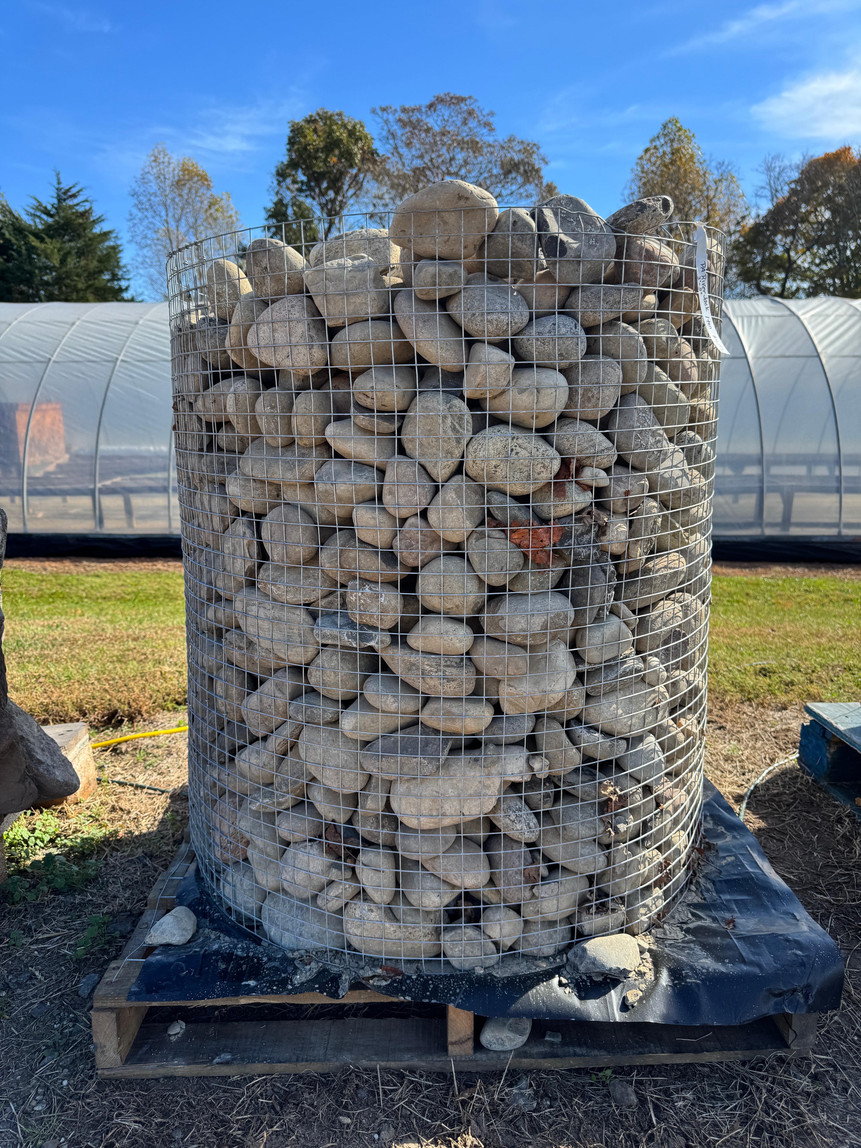 Wire cage pallet of smooth Pennsylvania River Jack pebbles