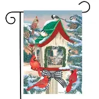 Snowy Birdhouse garden flag with cardinals, chickadees and a woodpecker at a snow-dusted birdhouse feeder with a plaid bow