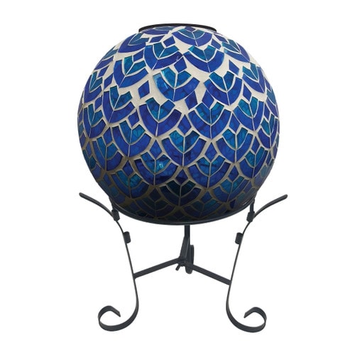 Blue and white scalloped mosaic glass gazing ball with solar LED light on a black metal stand
