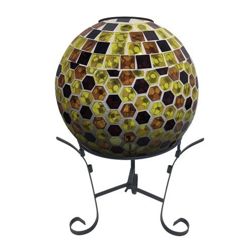 Brown and yellow mosaic glass gazing ball with solar LED light on a black metal stand