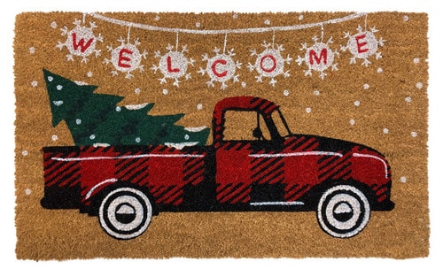 Red Checkered Truck coir doormat with a buffalo plaid truck hauling a Christmas tree under a snowy WELCOME pennant banner